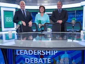 FILE PHOTO: B.C. NDP leader John Horgan, left to right, Liberal Leader Christy Clark and B.C. Green Party leader Andrew Weaver pose for a photo following the leaders debate in Vancouver, B.C., Thursday, April 20, 2017.