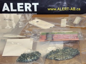 Members of Alberta Law Enforcement Response Team (ALERT) seized 400 fentanyl pills in a Lethbridge, Alta. apartment after the arrest of two suspected drug traffickers on Wednesday, May 17 2017