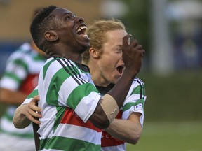 Foothills FC's Elijah Adekugbe, left, celebrates with team mate Mitchell Bauche after scoring a tie-breaking goal against Lane United FC in 2015.