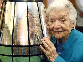 Frances Charbonneau checks out her late husbands name Arnie Charbonneau engraved on the Grey Cup (1940 and 1941)†when he played for Ottawa at the Colonel Belcher Retirement Residence in Calgary. He joined the Canadian Army and served with the Calgary Regiment, now The Kingís Own Calgary Regiment, during the Second World War.†Lieutenant Charbonneau†was awarded the Military Cross (M.C.) for his actions at Motta Montecorvino, Italy in October 1943 on Saturday May 13, 2017. DARREN MAKOWICHUK/Postmedia Network