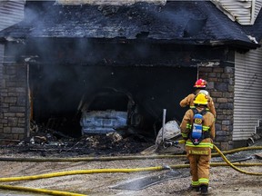 Calgary fire crews knock down a two-alarm house fire on Savanna Grove in the city's northeast. Al Charest/Postmedia