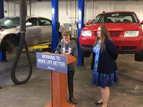 Kaylee Mannhardt, a graduate of the Motive Action Training Foundation, speaks at a government announcement Wednesday while Labour Minister Christina Gray looks on. The NDP government is raising the funding for skills training organizations such as Motive Action by $10 million over two years.