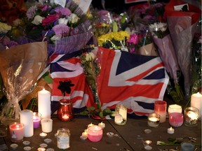 MANCHESTER, ENGLAND - MAY 23:  Members of the public attend a candlelit vigil, to honour the victims of Monday evening's terror attack, at Albert Square on May 23, 2017 in Manchester, England. Monday's explosion occurred at Manchester Arena as concert goers were leaving the venue after Ariana Grande had just finished performing. Greater Manchester Police are treating the explosion as a terrorist attack and have confirmed 22 fatalities and 59 injured.