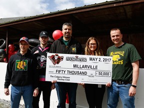 Cheque presentation with MSA hockey director Dave Keenan, Hitmen defenceman Brady Reagan, MSA chairman Bryan Pederson, Hitmen Foundation executive director Candice Goudie and MSA treasurer Damon Grover.