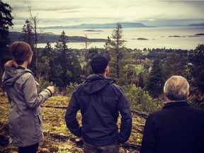 Olivia Hill and her husband, Jeff Singbeil, with Jeff's father, Don Singbeil, looking at lots at the Foothills in Lantzville, B.C.