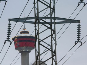 Photo shows the Calgary Tower framed behind power lines in downtown Calgary (file photo)