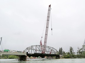 A massive crane waits in position to remove the steel truss of the original 12th Street Bridge over the Bow River to St. George's Island on Wednesday May 24, 2017. The move was postponed due to the high winds.
Gavin Young/Postmedia Network