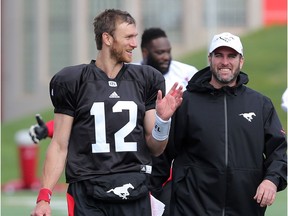 Quarterback Ricky Stanzi walk with quarterbacks coach Ryan Dinwiddie after morning practice at the Calgary Stampeders rookie camp on Thursday May 25, 2017.