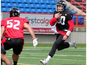 Quarterback Chris Merchant runs the ball during a drill at the Calgary Stampeders rookie camp on Thursday May 25, 2017.