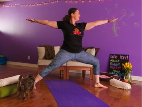 Yoga instructor Johanna Steinfeld demonstrates the warrior II or Virabhandrasana II pose for her May 2017 yoga column. Ground yourself down through your legs and feet. Be strong in your arms and relaxed in your breath, eyes and shoulders. Gavin Young/Postmedia Network