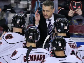 Calgary Hitmen head coach Mark French talks to his players during a time out against the Lethbridge Hurricanes at the Scotiabank Saddledome on Sunday January 15, 2017.