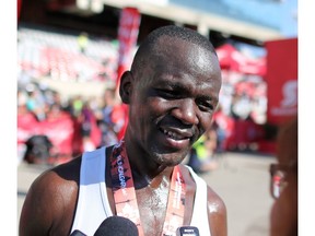 Daniel Kipkoech speaks with media after finishing in first place in the men's division of the Scotiabank Calgary Marathon on Sunday May 28, 2017.