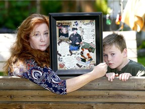 Mom Susyn Wagner with her son Matthew, holds up pictures of her eldest son Zackery Maller who died April 7, 2014 from drugs. She is starting the Calgary chapter of GRASP (Grief Recovery After a Substance Passing)