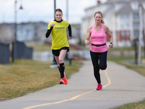 Val Yanke, right runs with Country Hills Running Room assistant manager Melissa Kendrick on Monday May 1, 2017. Yanke became an active runner and quit smoking through the Running Room's Run to Quit program. Gavin Young/Postmedia Network