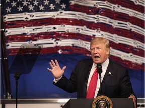 President Donald Trump speaks to workers at the headquarters of tool manufacturer Snap-On on April 18, 2017 in Kenosha, Wisconsin. During the visit, Trump signed an executive order to try to bring jobs back to American workers and revamp the H-1B visa guest worker program.