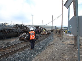 Transportation Safety Board inspector surveys the derailment at CP Rail's Alyth Yard last February.