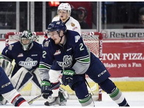 REGINA, SASK :  Seattle Thunderbirds defenceman Austin Strand, right, battles for the puck in  Game 2 of the WHL championship series at the Brandt Centre in Regina on Sunday, May 6, 2017.