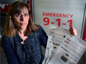 Suzanne Oel, Foothills Regional 911 Commission chair holds letters of support from all municipalities in her region to the Minister of Health titled "Municipal Support for the Return of EMS Dispatch to FRESC" in Priddis,