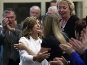 Interim Tory leader Rona Ambrose receives a standing ovation before addressing the party's caucus for the last time as official Opposition leader Wednesday. A permanent leader will be chosen May 27.
