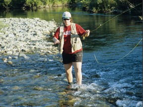 Sarah Masterman, 13, fly fishes in a southern Alberta creek in 1998.