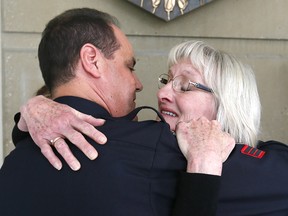 Peggy Mitchell, mother of Lisa Mitchell, hugs Calgary Police Sgt. John Hebert after Allan Shyback was convicted of manslaughter on Thursday May 18, 2017.