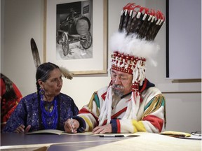 Chief Stan Grier, right of the Piikani Nation of the Blackfoot Confederacy, and Councilwoman Casey Camp-Horinek of the Ponca Nation, sign a declaration against the planned Keystone XL pipeline in Calgary, Alta., Wednesday, May 17, 2017.THE CANADIAN PRESS/Jeff McIntosh ORG XMIT: JMC107