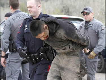 Calgary Police take into custody two men after a collision on Parkdale Blvd and Shaganappi Tr NW about 1 pm in Calgary on Tuesday May 9, 2017. The alleged stolen vehicle crashed into at least two other vehicles. The men were taken into custody in a parking lot near Edworthy Park. The were treated at scene by EMS for a variety of injuries. Jim Wells//Postmedia