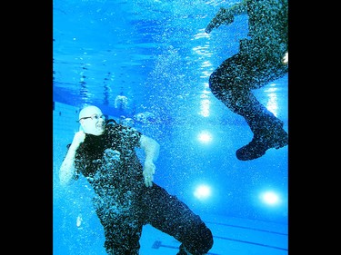 Members of the Calgary Police Service Unit Marine Unit train in the dive tank at Repsol Spaorts Centre in Calgary on Thursday May 11, 2017. The teams' training consists of a number of requirements and includes hand to hand, combat and defensive tactics in, along and under the water. Jim Wells//Postmedia