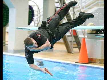 Members of the Calgary Police Service Unit Marine Unit train in the dive tank at Repsol Spaorts Centre in Calgary on Thursday May 11, 2017. The teams' training consists of a number of requirements and includes hand to hand, combat and defensive tactics in, along and under the water. Jim Wells//Postmedia