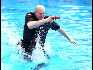 Members of the Calgary Police Service Unit Marine Unit train in the dive tank at Repsol Spaorts Centre in Calgary on Thursday May 11, 2017. The teams' training consists of a number of requirements and includes hand to hand, combat and defensive tactics in, along and under the water. Jim Wells//Postmedia