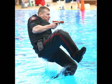 Members of the Calgary Police Service Unit Marine Unit train in the dive tank at Repsol Spaorts Centre in Calgary on Thursday May 11, 2017. The teams' training consists of a number of requirements and includes hand to hand, combat and defensive tactics in, along and under the water. The team was finishing their first day of training at the pool. Jim Wells//Postmedia