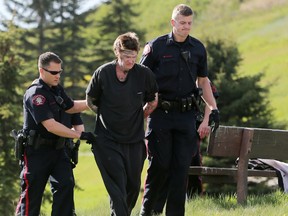 Police arrest a man near Max Bell arena suspected of robbing a bank on Thursday, May 18 2017. Gavin Young/Postmedia Network