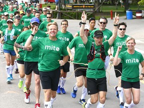 Team mito consisting of 115 runners who will be tied together during the Scotiabank Calgary Marathon to break a world record and raise 145 thousand for Mitochondria disease practice at the Stampede grounds in Calgary on Saturday May 27, 2017. DARREN MAKOWICHUK/Postmedia Network