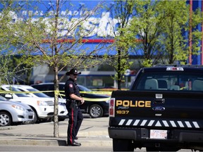 The scene of a double homicide is locked down outside of the Real Canadian Superstore in Mckenzie Towne in Calgary, Alta., on May 22, 2017.