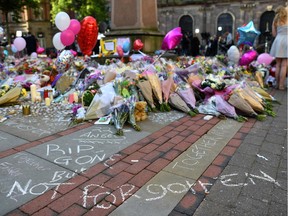 Flowers, messages and candles are pictured in St. Ann's Square in Manchester, placed in tribute to the victims of the May 22 terror attack.