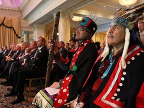 FILE PHOTO: Chief Martin Louie Nadleh Whut'en (R) and Hereditary Chief Na'Moks (L) listen at the Enbridge shareholders meeting. .  First Nations  Freedom Train march to Enbridge AGM meeting at the  King Edward Hotel , Wednesday May 9, 2012.