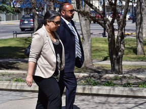 Varinder and Ravinder Sidhu walk into Red Deer court on May 11, 2017 to be sentenced for their role in human trafficikng. Photo by Bryan Passifiume, Postmedia