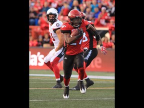 The Calgary Stampeders Tunde Adeleke runs in a touch down late in the second half during  CFL action against the Ottawa Redblacks at McMahon Stadium in Calgary on Thursday June 29, 2017. Gavin Young/Postmedia Network