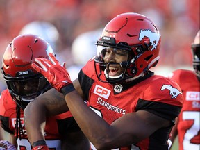 The Calgary Stampeders Marken Michel celebrates his touchdown late in the second half during  CFL action against the Ottawa Redblacks at McMahon Stadium in Calgary on Thursday June 29, 2017. Gavin Young/Postmedia Network