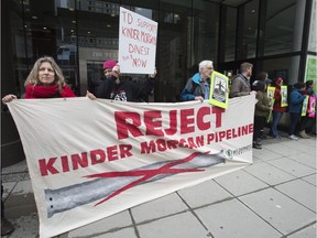 First Nations and anti-pipeline groups rally outside the TD bank in downtown Vancouver.
