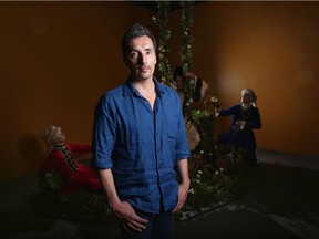 Artist Kent Monkman  in front of the installation, Scent of a Beaver, which is part of the exhibit Shame and Prejudice: A Story of Resilience at the Glenbow Museum.