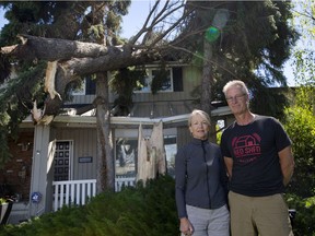 Carolyn and Dave Cheetham look at damage to their house  on Wednesday June 21, 2017 after a wind storm blew through Red Deer Tuesday night.