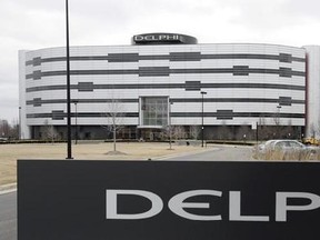 FILE - In this March 22, 2006, file photo, Delphi&#039;s World Headquarters is shown in Troy, Mich. Automotive electronics and parts maker Delphi and French transport company Transdev have plans to use autonomous taxis and a shuttle van to carry passengers on roadways in France without a human behind the wheel as early as 2018. The companies announced the partnership Wednesday, June 7, 2017, and said it could be the first deployment of autonomous taxis and vans on real roads without human backup pilo