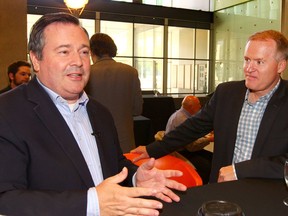 Alberta PC leader Jason Kenney visits with guests including MLA Grant Hunter (R) before speaking at a riding event held at the University of Calgary in Calgary on Friday June 9, 2017. Jim Wells/Postmedia