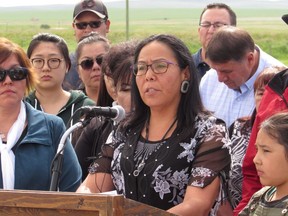 Ramona Big Head, a principal on the Blood Tribe in southern Alberta speaks to reporters in Standoff, Alta., on Thursday, June 22, 2017. A health board employee has been placed on administrative leave after a band member received a racial slur in a text message.