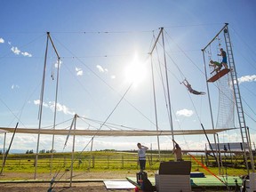 Dany and Josh Munden instruct budding acrobats at the Rocky Mountain Flying Trapeze.