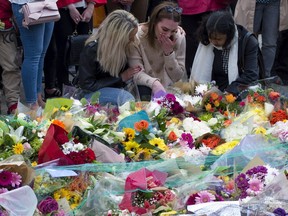 Members of the public lay flowers near the scene of the London Bridge terrorist attack on Wednesday.