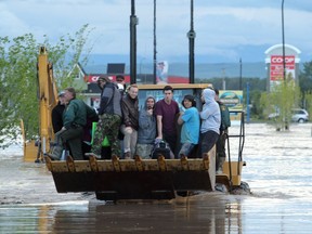 Black Diamond/High River

Local Input~ Lorraine Hjalte/ Calgary Herald --Thursday evening a steady stream of people were arriving by boat and helicopter on 12th Ave. as the Highwood river left a great portion of the town underwater in High Rver on June 20, 2013.  00046260A       SLUG:
Lorraine Hjalte Lorraine Hjalte Lorraine Hjalte, Calgary Herald