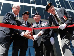 From left;  Legion members Alan Pentney Treasurer, Mark Barham, Dominion Treasurer, Bill Cox, President and Al Seddon, Vice-President cut the ribbon at the official opening of the new Royal Canadian Legion Branch 264 building in Kensington on Tuesday June 20, 2017.