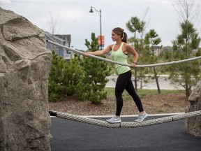 Seton YMCA personal trainer Paulina Gornicki works out at the TransCanada Outdoor Fitness Park in Mahogany.